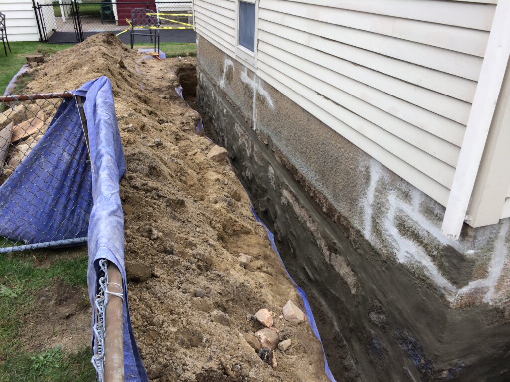 Foundation being prepared for waterproofing. 