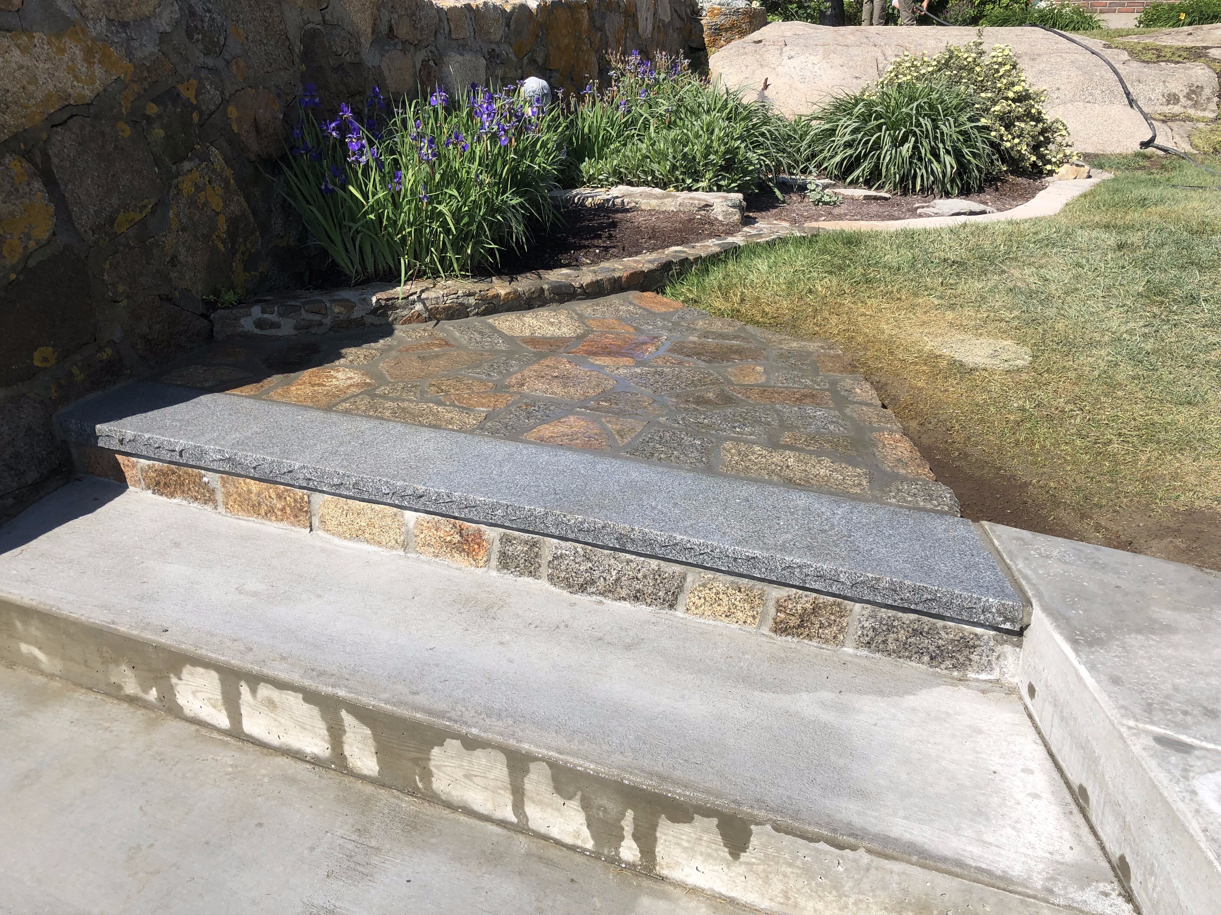 Newly constructed stone steps in a backyard in Cambridge, MA.