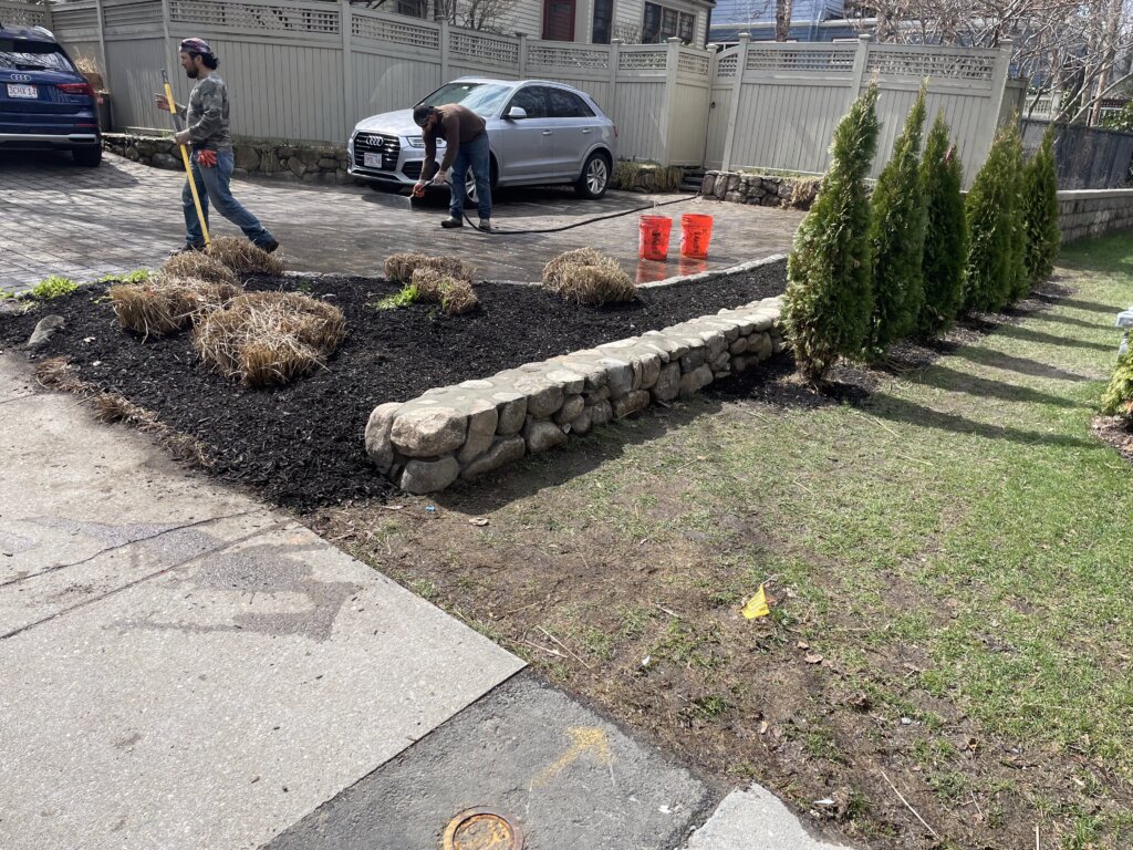 Newly installed stone driveway and retaining wall in Boston, MA.