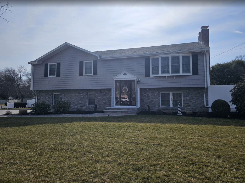 Front view of a Boston, MA house with a stone exterior finish.