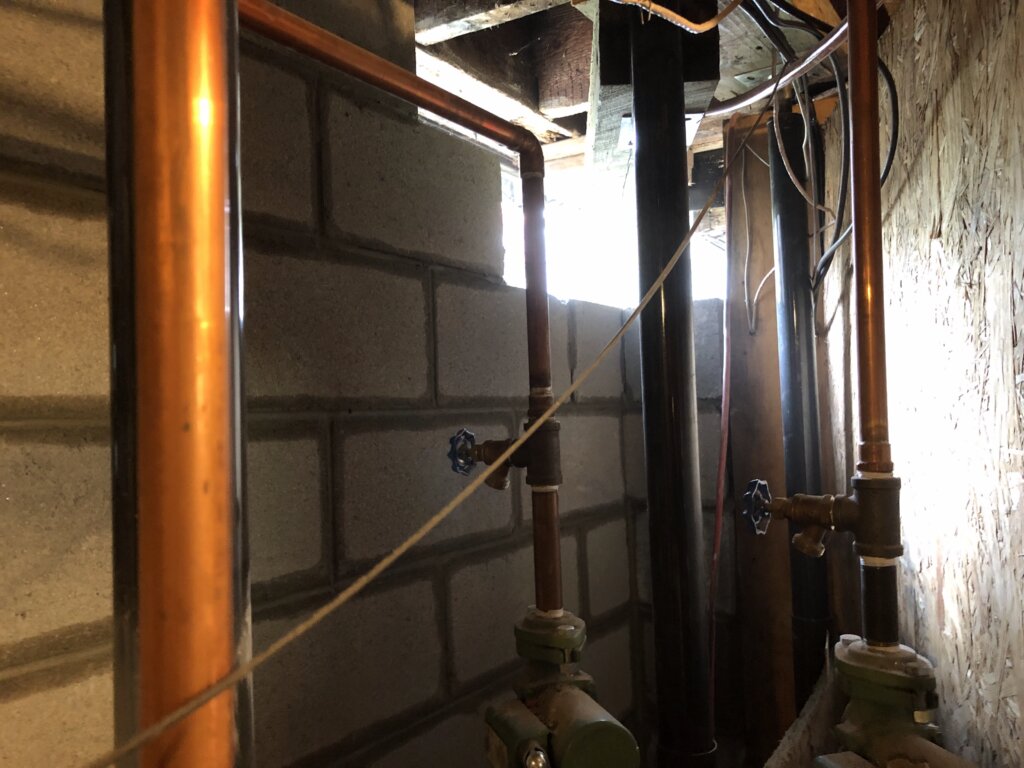 Interior view of a reconstructed foundation wall following structural repairs