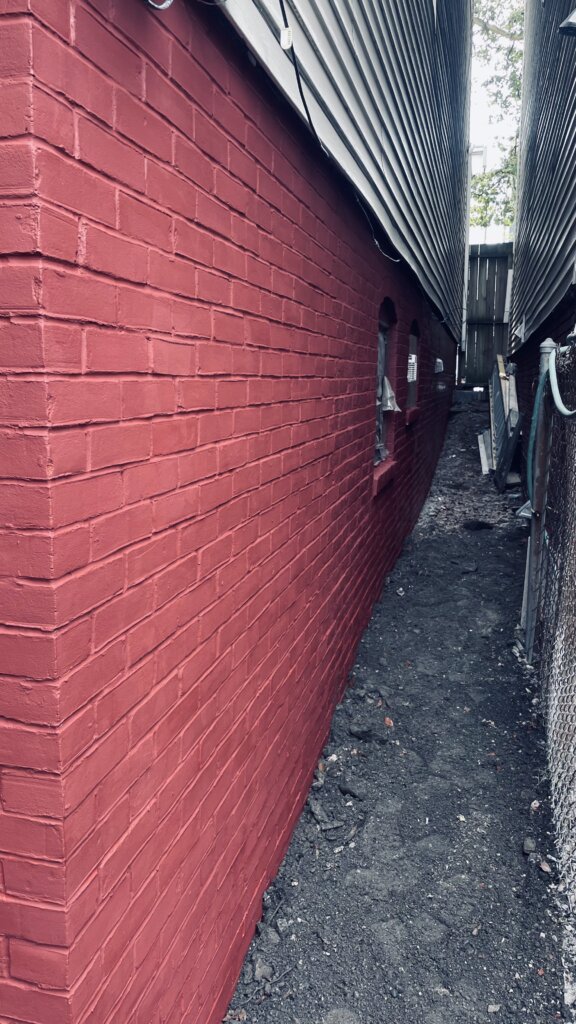 Completed foundation repair project showing the restored exterior foundation wall