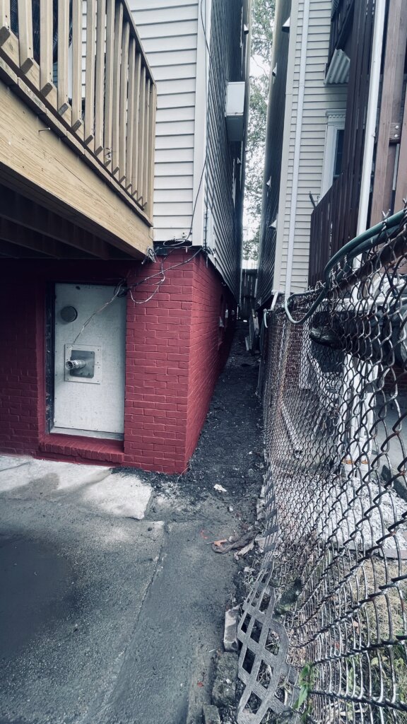 Completed foundation repair project showing the restored exterior foundation wall