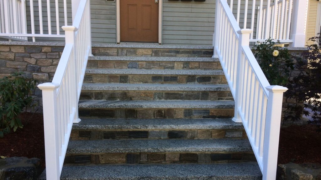 Granite front steps and stone veneer entryway at a Boston, MA home