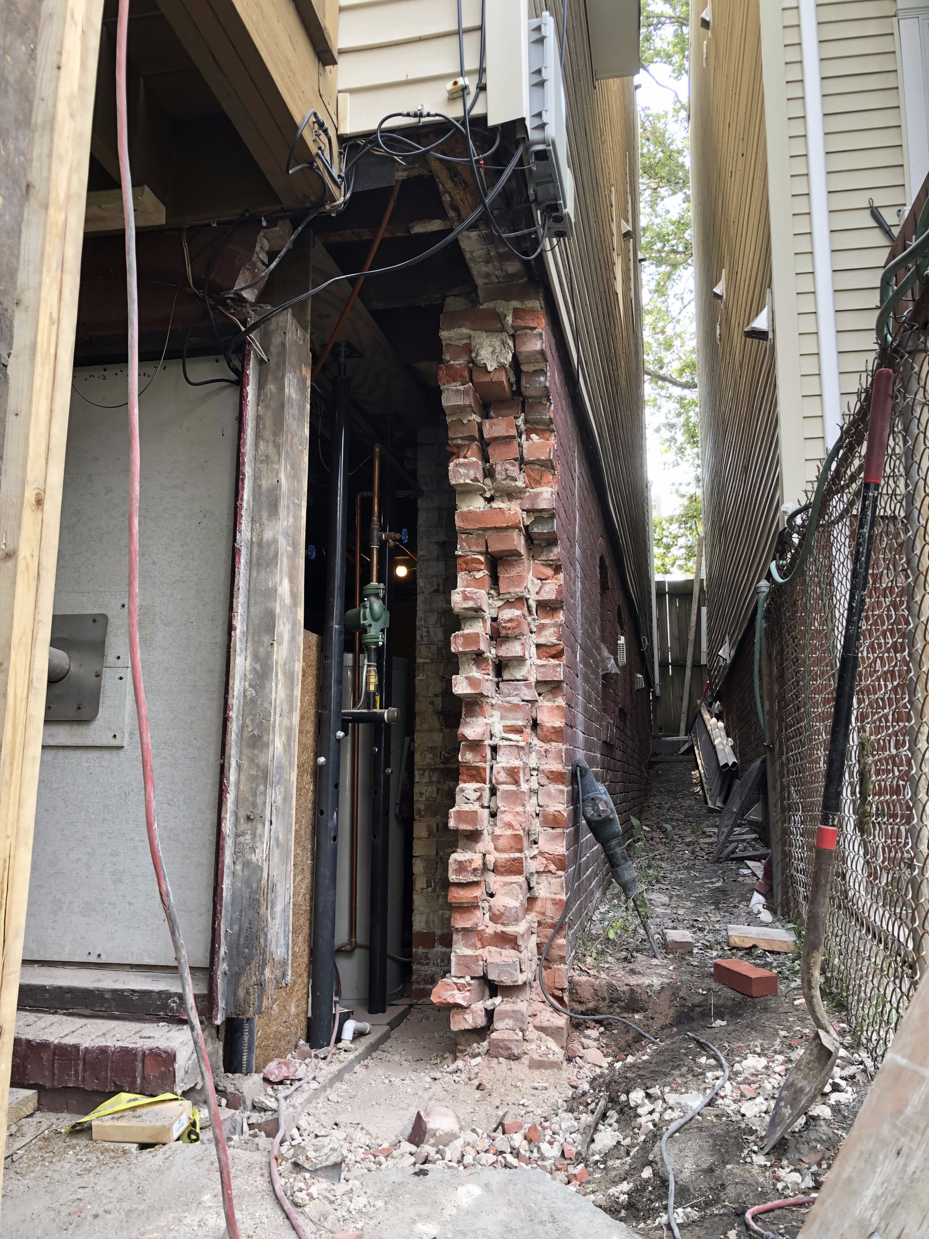 Structural brick foundation repair project on an older residential home in Boston, MA 