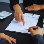 homeowner reviewing a cash offer vs listing paperwork