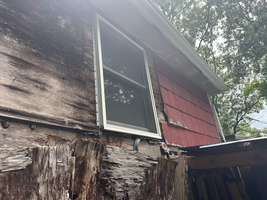 Side view of distressed home at 37 Montgomery Drive prior to rebuild