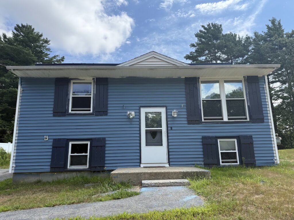Exterior view of distressed house purchased for cash at 90 Esta Rd