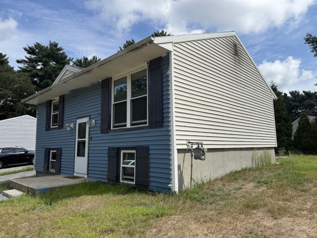 Side view of outdated home at 90 Esta Rd before renovation