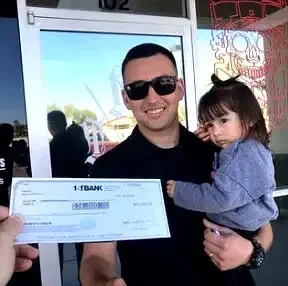 Arizona family receiving check after selling their mobile home.