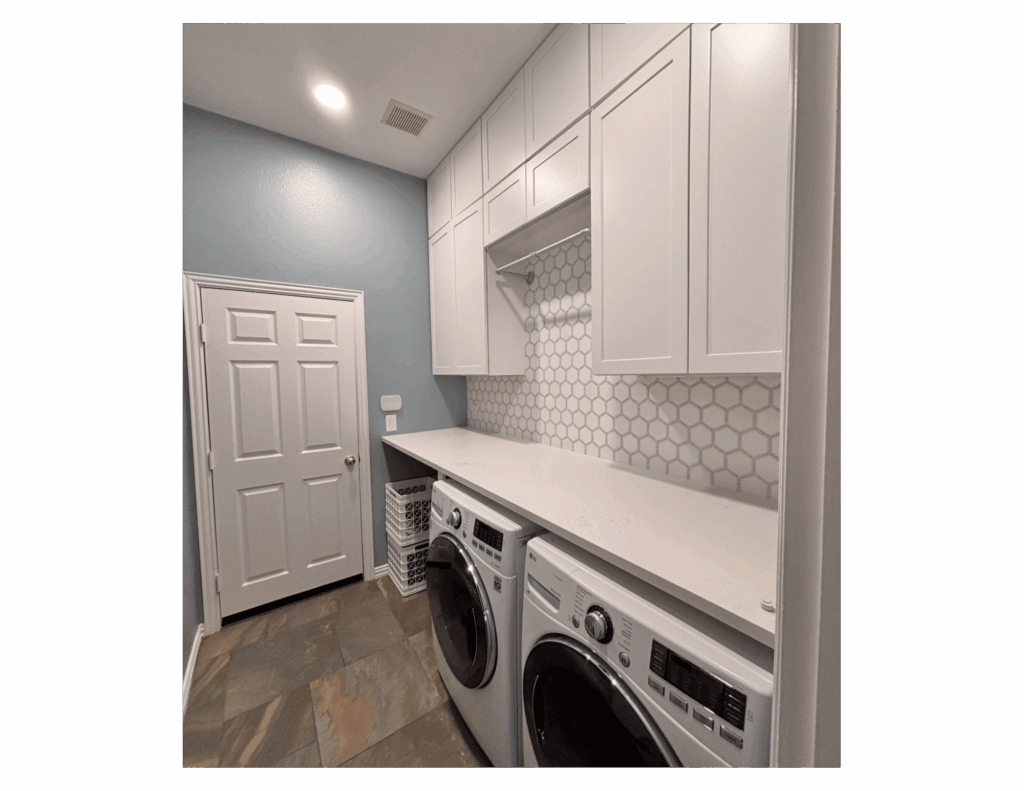 modern white laundry room remodel with floor to ceiling shaker cabinets