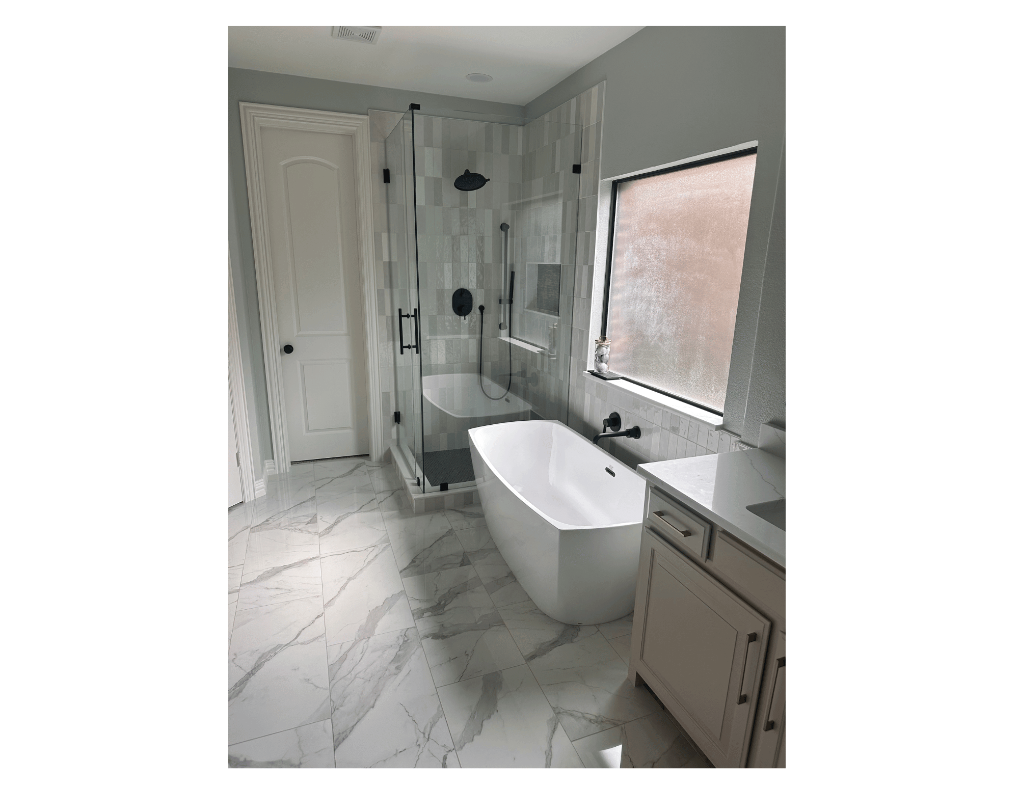 marble floors in bathroom with update frameless shower glass and free standing tub