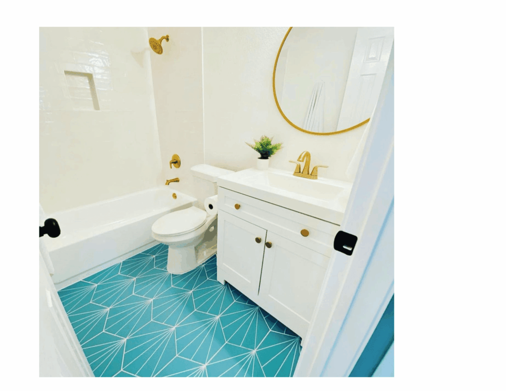 white bathroom with fun turquoise floor tile