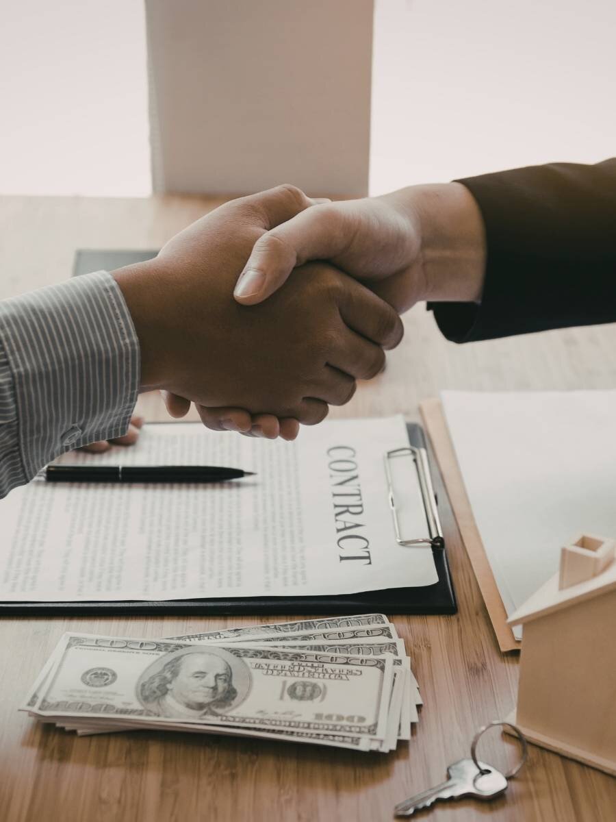 signing cash home sale closing paperwork in Louisville Kentucky