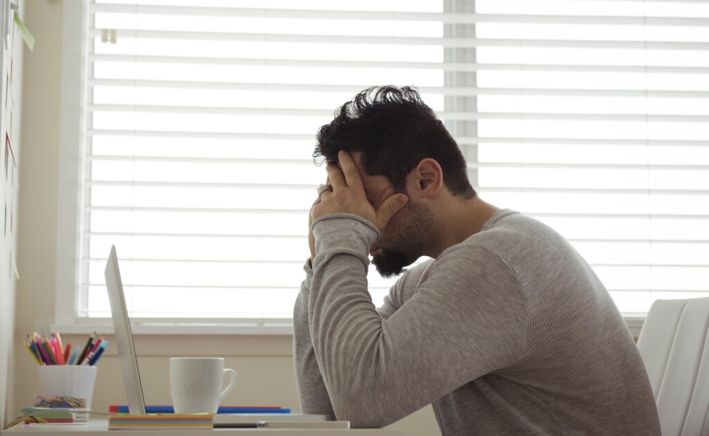 man stressed because he's behind on lot rent in Texas mobile home park.
