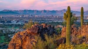 Phoenix metro skyline at sunset from desert hilltop - mobile home communities in the Phoenix metro - AZ Mobile Homes Direct
