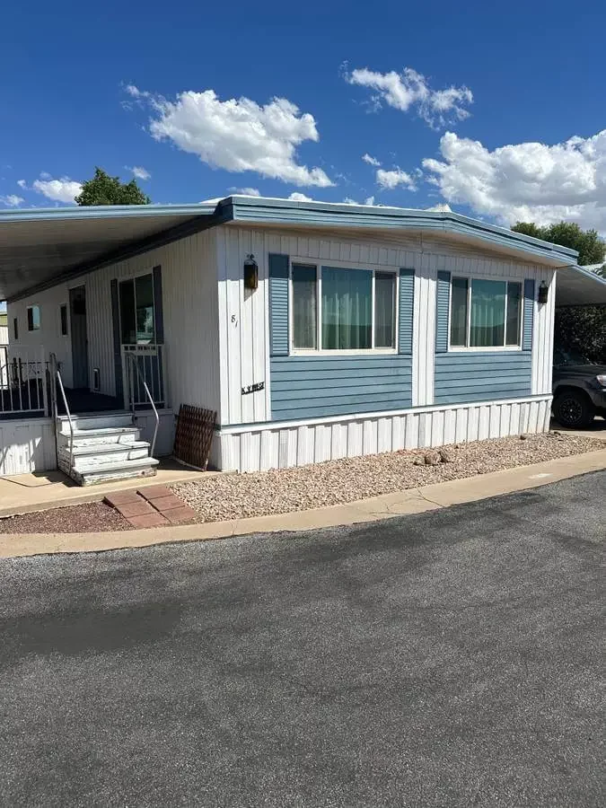 Double-wide mobile home with covered porch in a Tucson Arizona mobile home park
