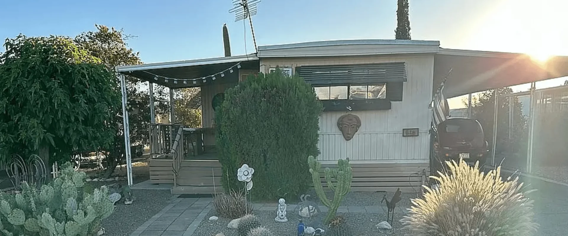 Single-wide mobile home with desert landscaping in a Tucson Arizona mobile home park