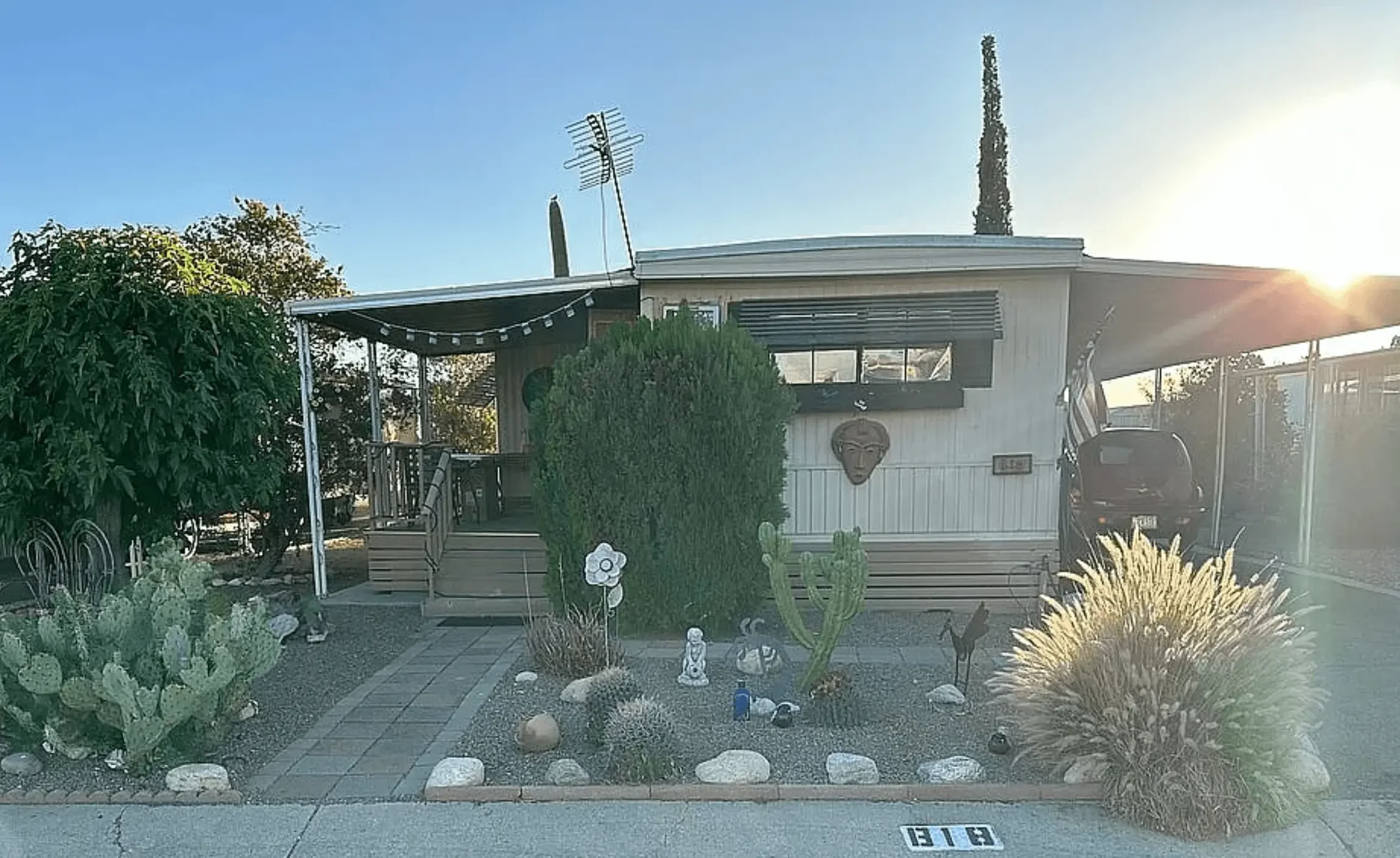 Single-wide mobile home with desert landscaping in a Tucson Arizona mobile home park