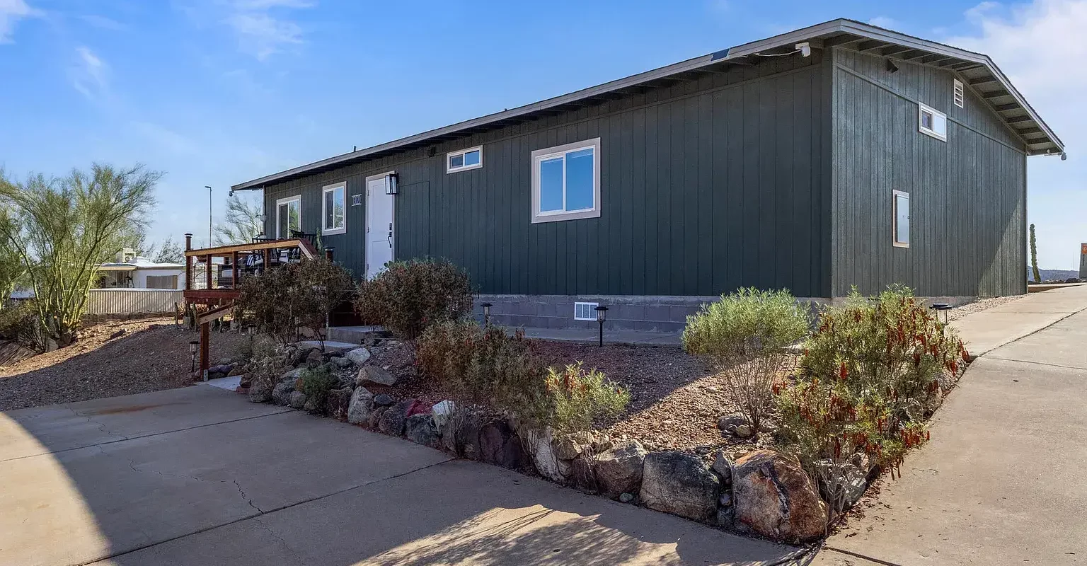 Large double-wide mobile home with deck in Tucson Arizona desert property