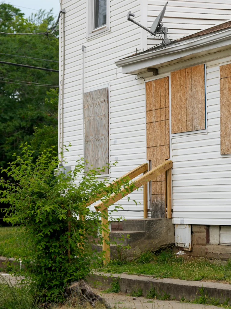distressed/aging home exterior
