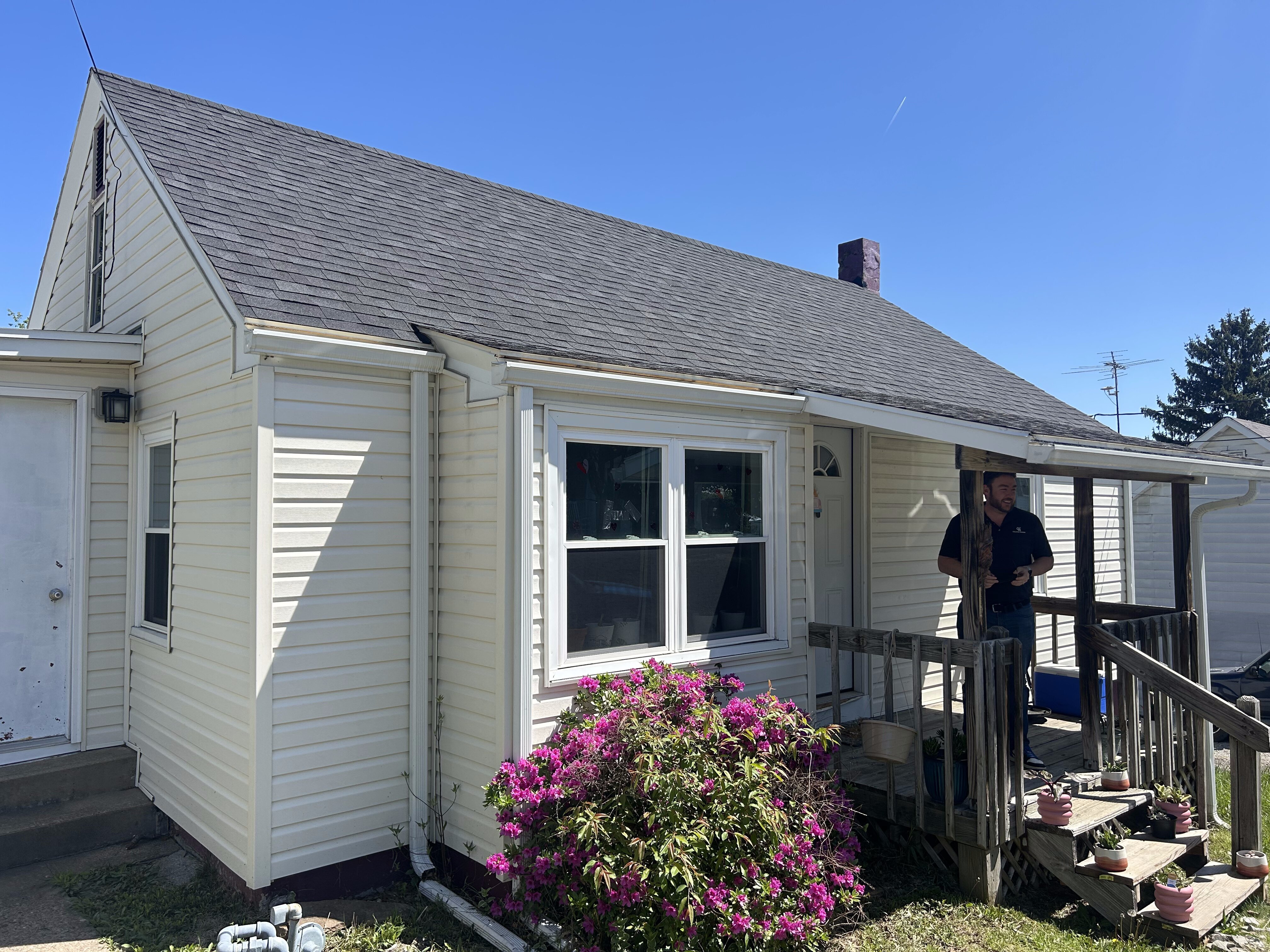 DeGusipe Real Estate looking at a property.