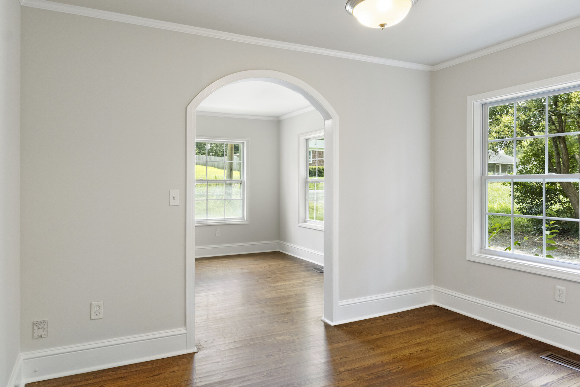 Archway and rustic wood floors