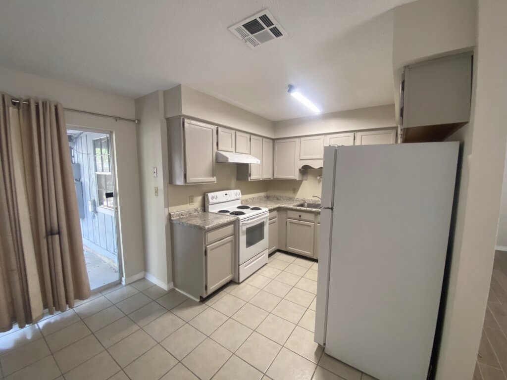 Renovated kitchen in a Northshore rental property with updated cabinets, appliances, and finishes