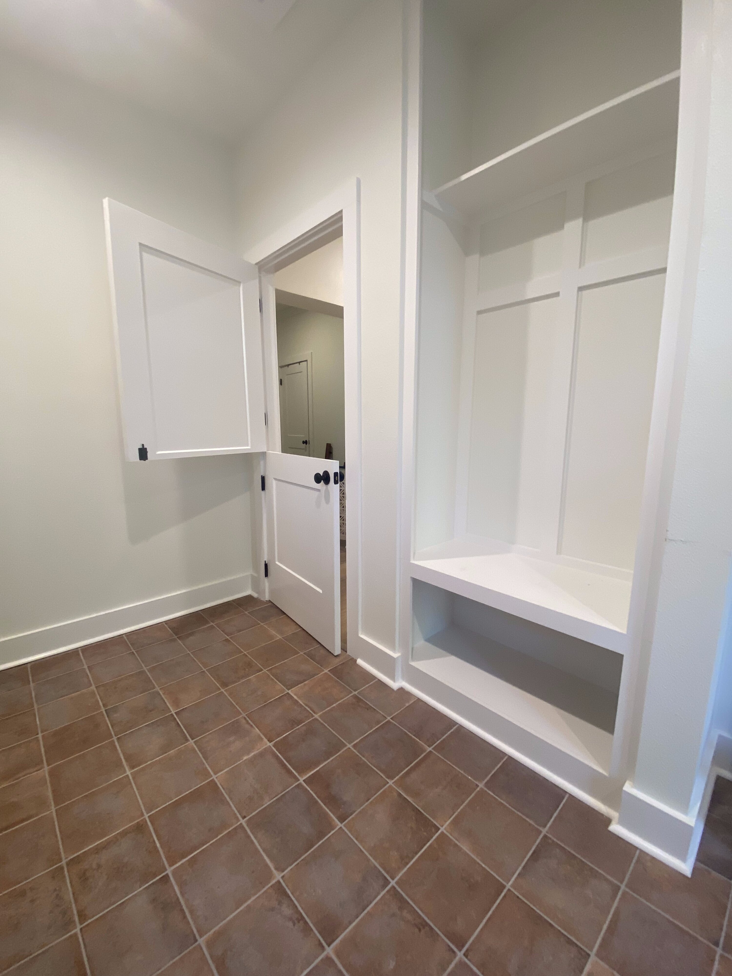 Built-in mudroom bench and storage in Mandeville home addition
