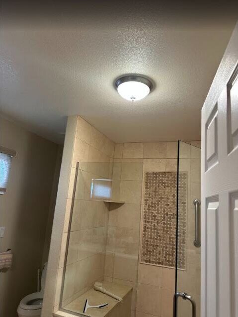 Finished bathroom shower and vanity area, completed remodel by The Build Squad