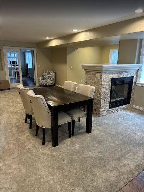Basement dining area with bar seating, completed remodel by The Build Squad