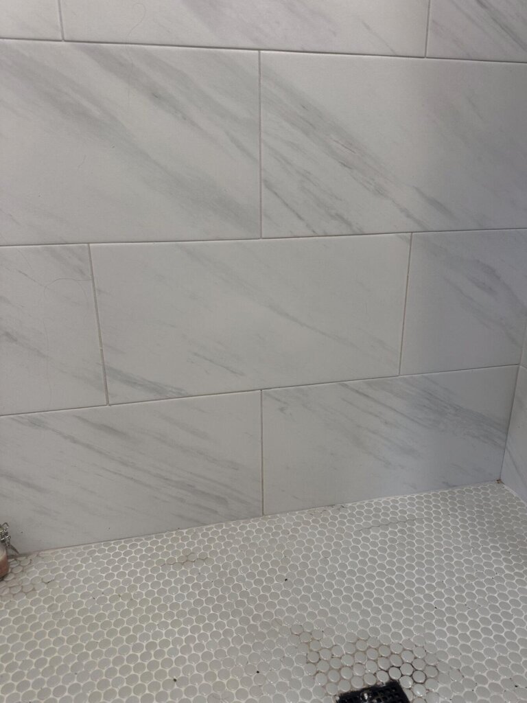 bathroom marble tile shower with bench