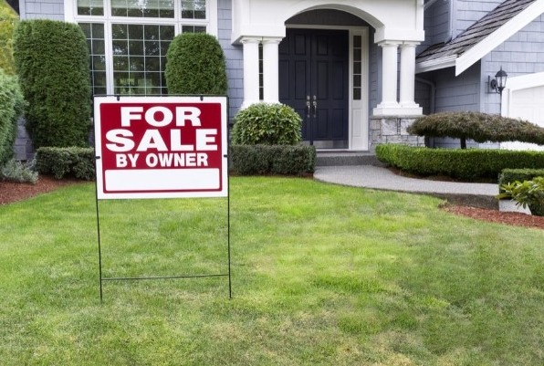 for sale by owner sign in front of Ontario home
