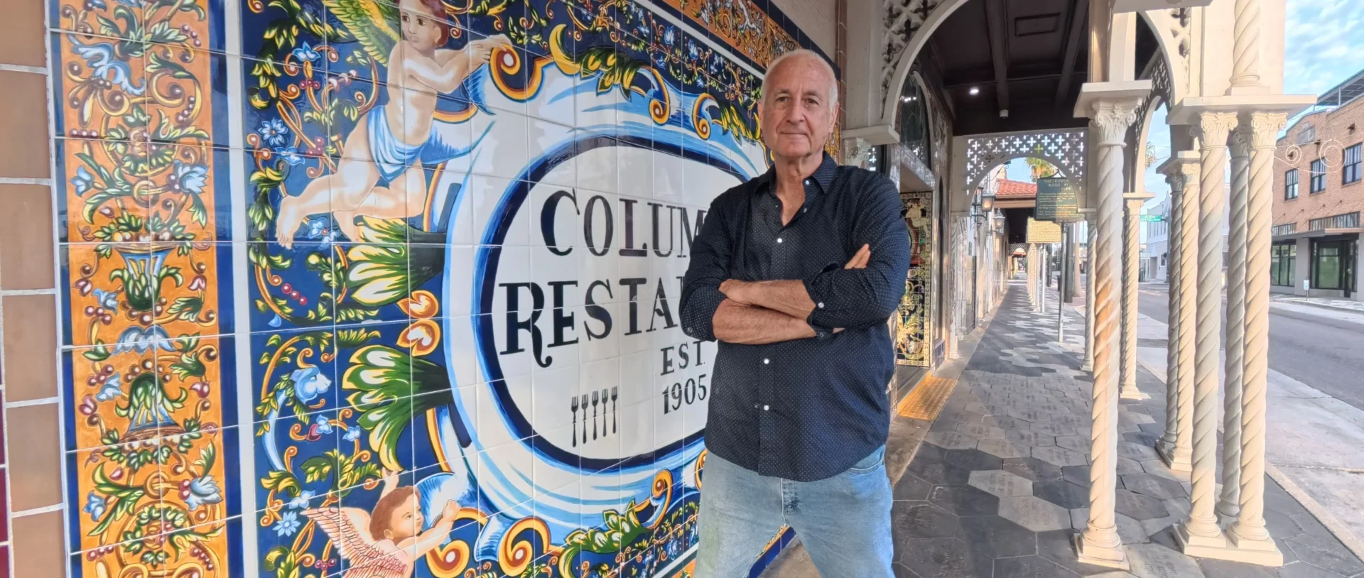 HQ Home Buyers' owner in front of Columbia Restaurant