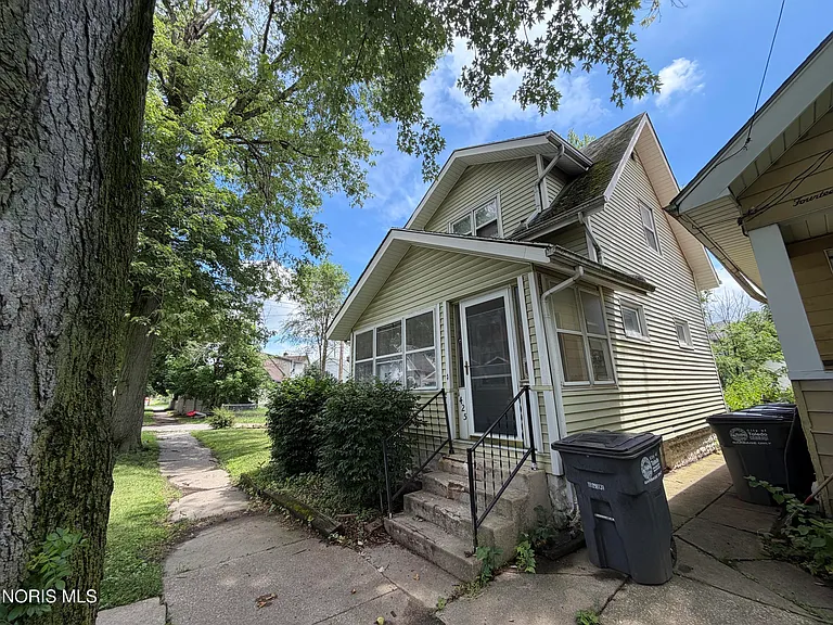 Homeowner behind on mortgage payments in Canal Winchester Ohio reviewing overdue bills