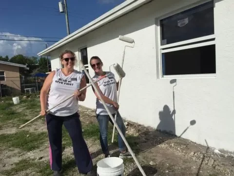 Texas Home Buyers team painting walls for habitat for humanity