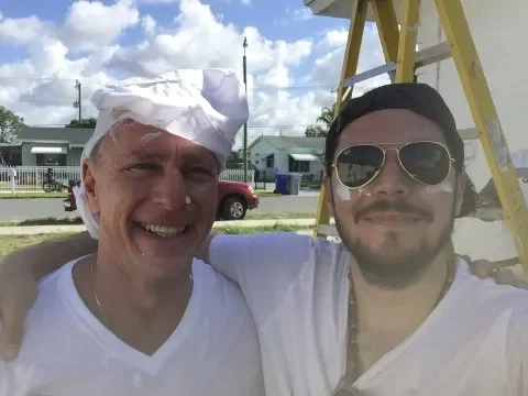 texas home buyers team in front of ladder