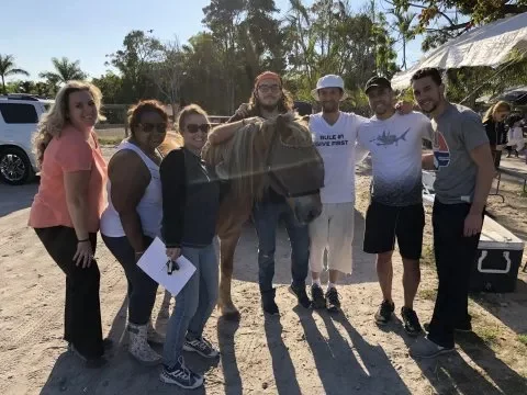 texas home buyer team after volunteering at happy farm