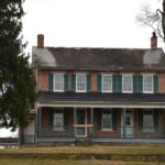 Michigan brick home green shutters — sell house fast cash buyer Metro Detroit Wayne County