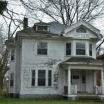 Old white Michigan house porch — sell house tax lien cash buyer Wayne County