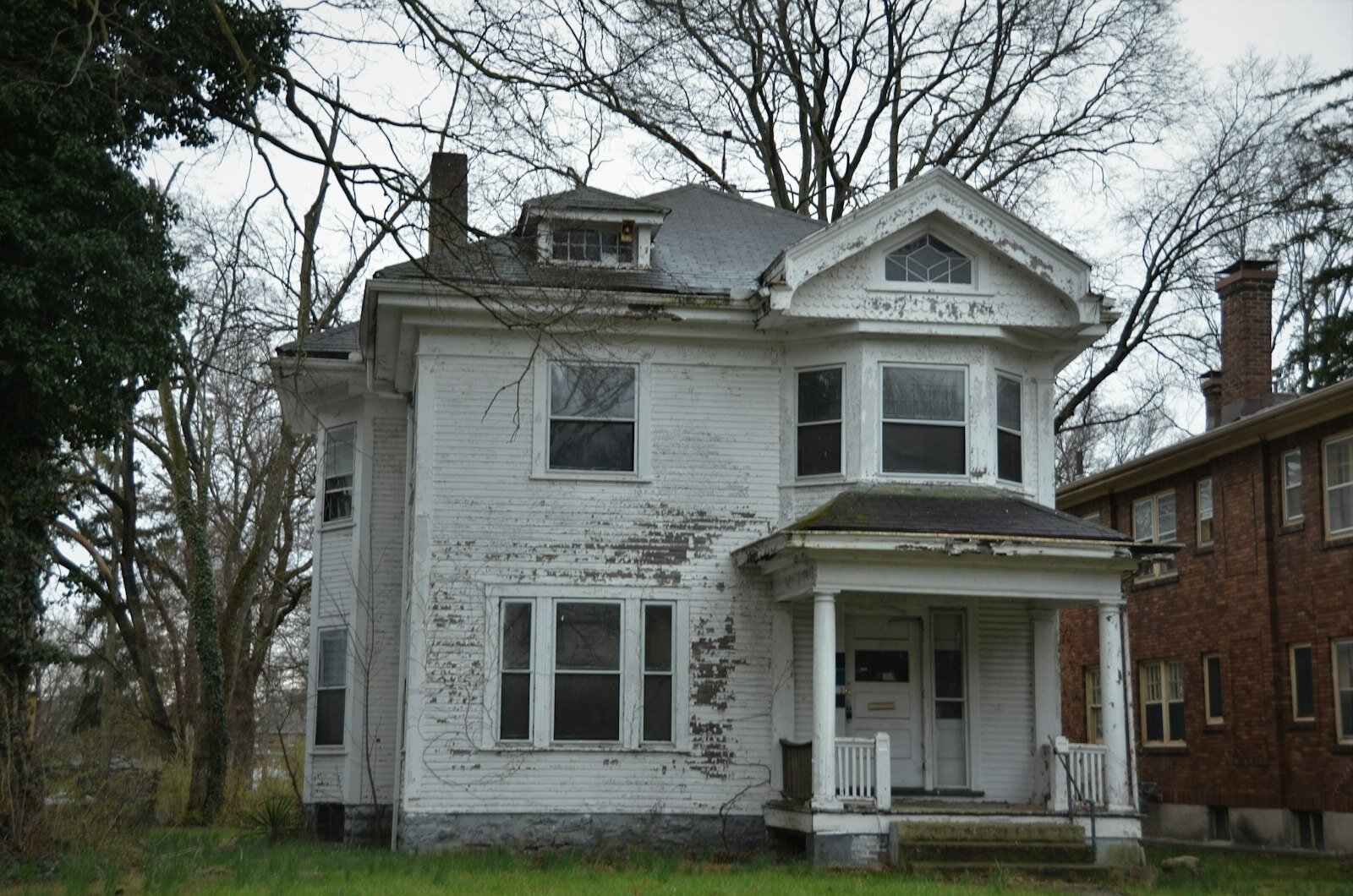 Old white Michigan house with porch