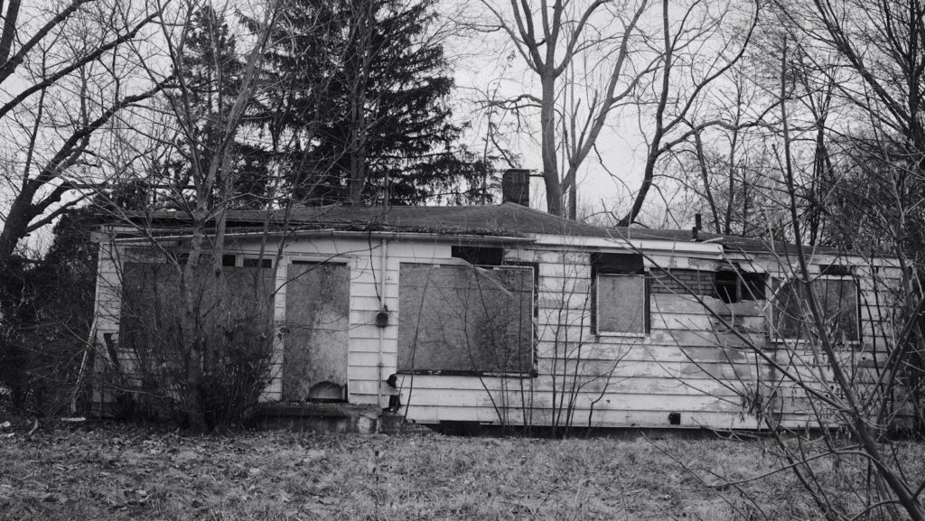 Run-down Michigan house winter Flint MI — sell house as-is cash offer Michigan