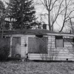 Run-down Michigan house winter Flint MI — sell house as-is cash offer Michigan