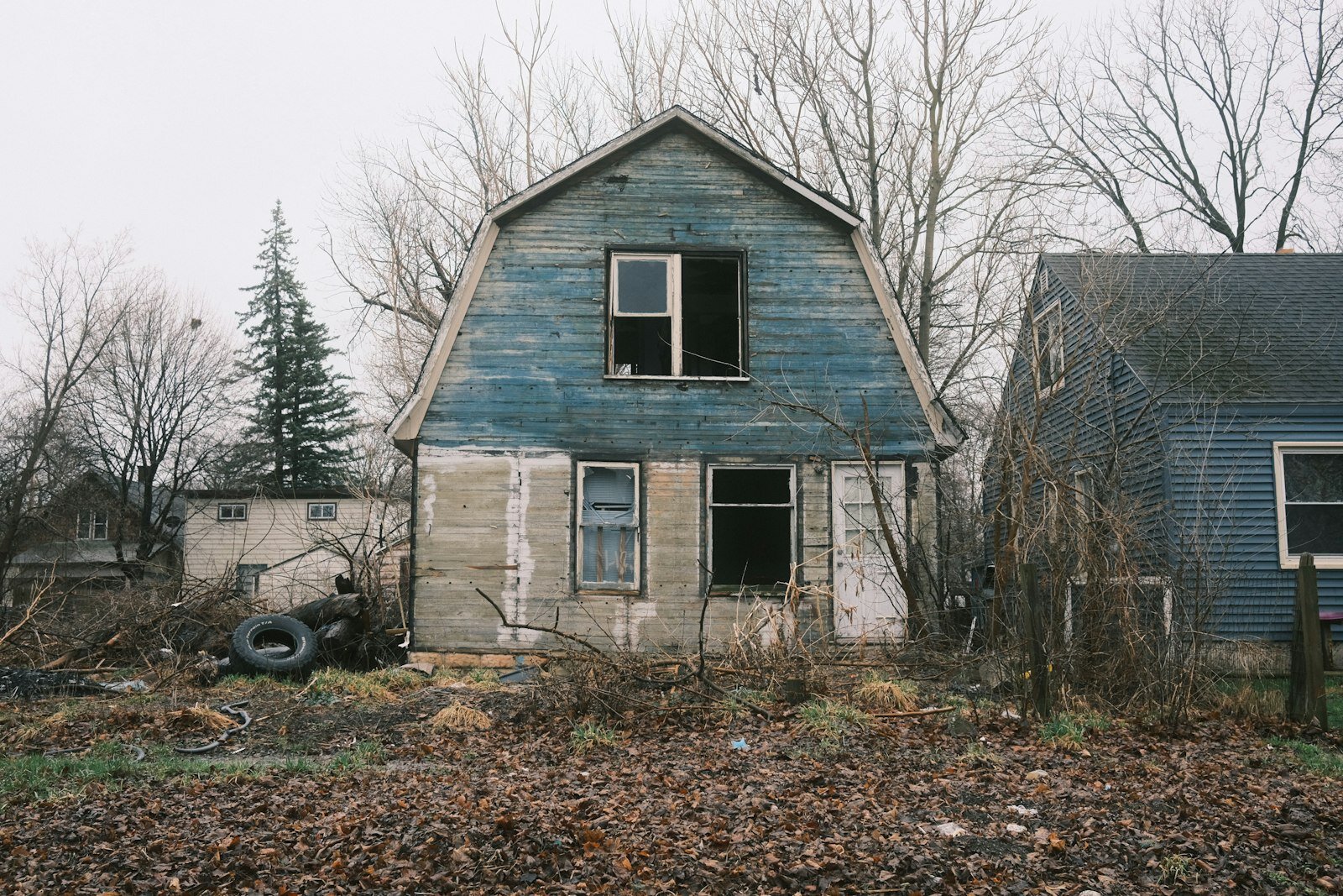Old blue vacant Michigan home