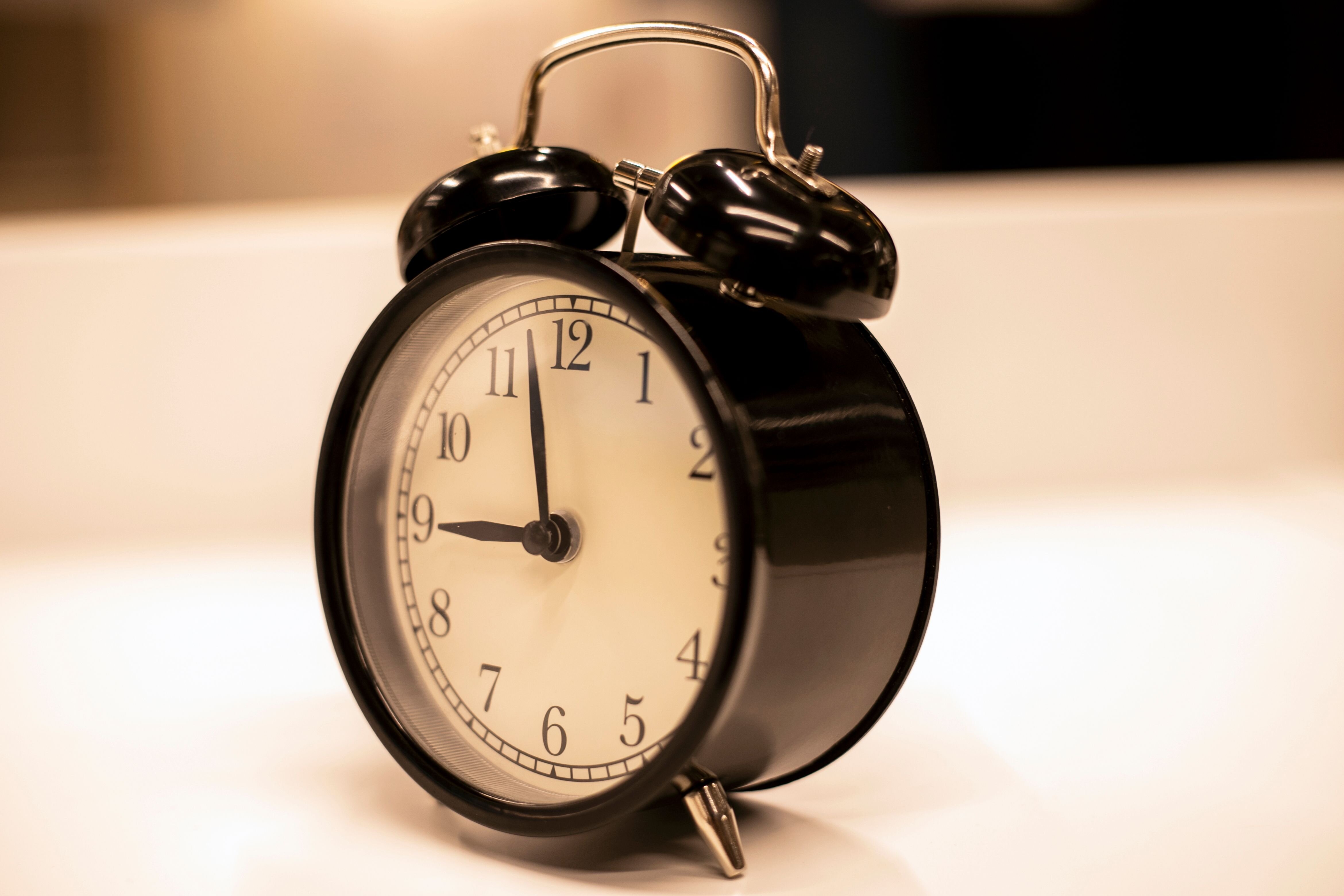 Close-up of an alarm clock, representing the final hours before a foreclosure auction