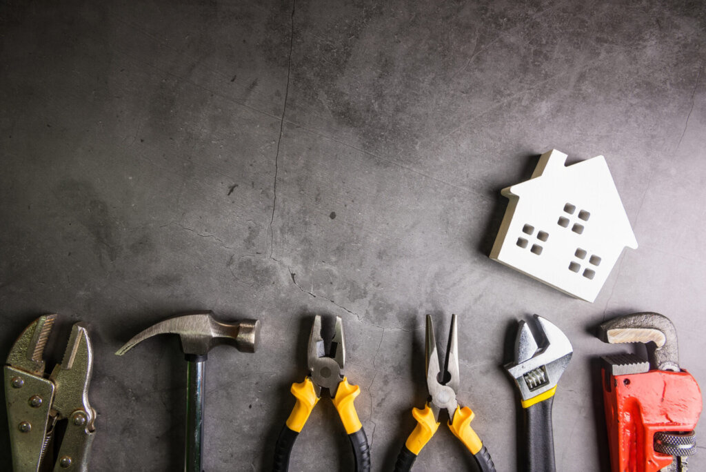 Homeowner evaluating major roof and exterior repairs before selling a house in Knoxville, TN