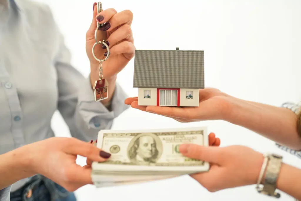 Homeowner reviewing a cash purchase agreement with a home buyer