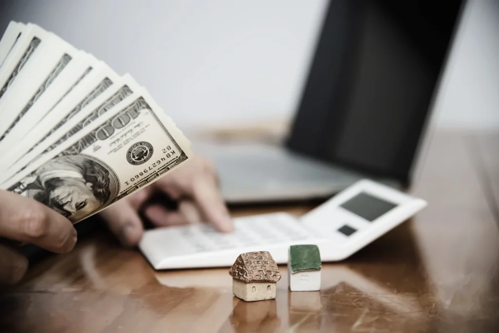 Homeowner comparing an original cash offer with a proposed price reduction before closing