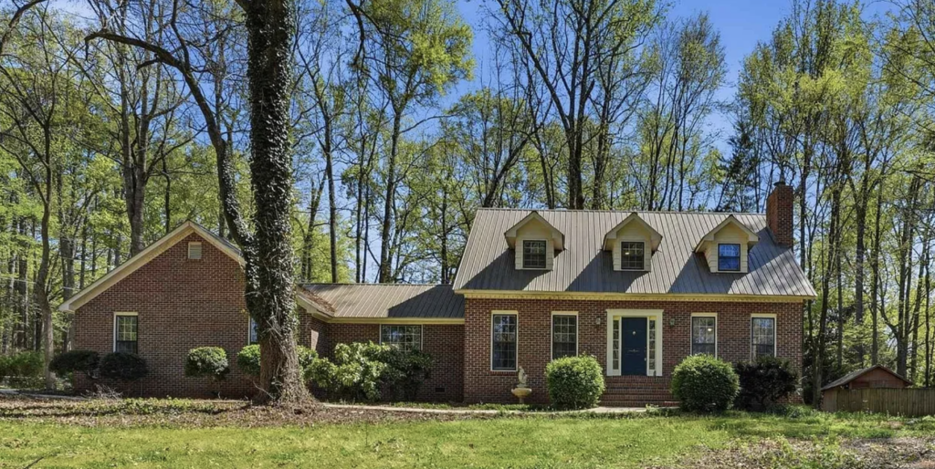 Custom residential roofing replacement project and full exterior home remodel completed by local contractors in Huntsville, Alabama