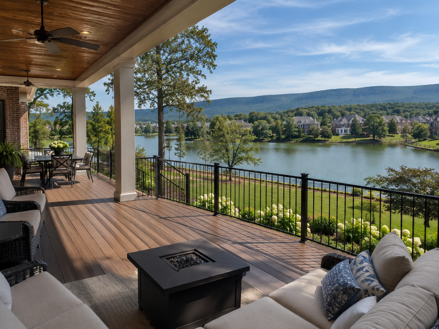 Newly built composite deck with covered outdoor living space overlooking a neighborhood lake in Hampton Cove, Alabama.